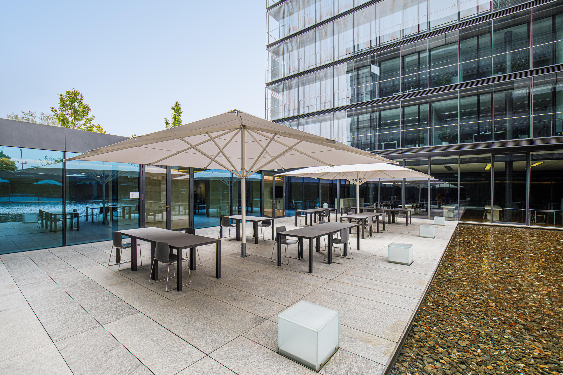 Terrace with white parasols